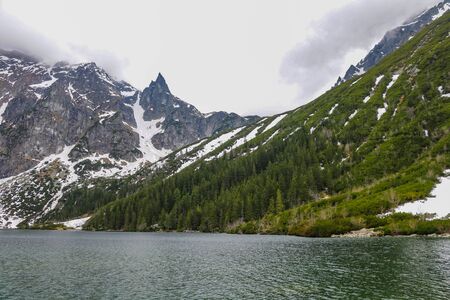 Lake in mountains. Morskie Oko Sea Eye Lake is the most popular place in High Tatra Mountains, Polandの写真素材