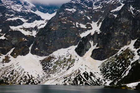 Lake in mountains. Morskie Oko Sea Eye Lake is the most popular place in High Tatra Mountains, Polandの写真素材