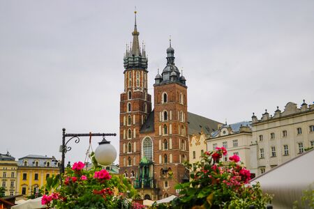 Krakow, Poland - May 21, 2019: View of flowers in the foreground, in the background the church is out of focusのeditorial素材