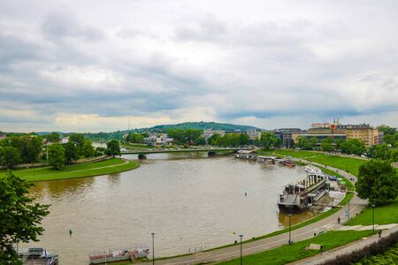 Krakow, Poland, 24 May 2019 - Picturesque landscape on coast river Wisla with boatsのeditorial素材