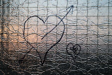 Heart on glass during sunset, loveの写真素材