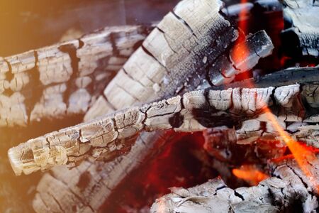 Smoldering coals from the fire. A fading bonfire.の写真素材
