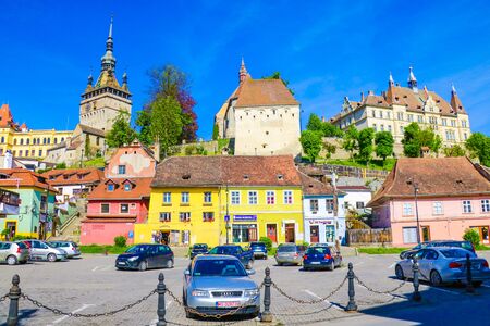 Sighisoara, Romania, May 11, 2019: Beautiful view of colorful houses and Tower Clock Turnul cu ceas in Sighisoara citadelのeditorial素材