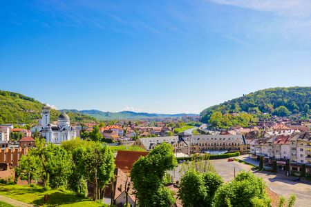 Sighisoara, Romania, May 12, 2019: Morning cityscape of Sighisoara with Sighisoara City Hall and Holy Trinity Church on background. Attractive summer view of medieval townのeditorial素材