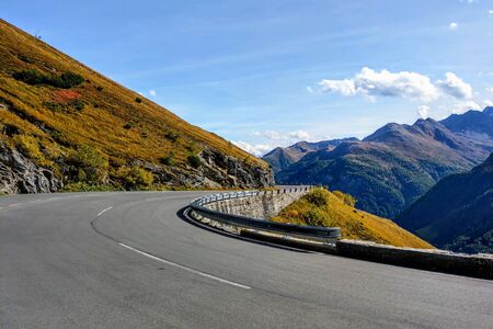 Beautiful alpine mountains, Austria. Fresh clean air, nature background. On the tops of the mountains lies snow all year round. Selective focus. Mountain scenic roadの写真素材