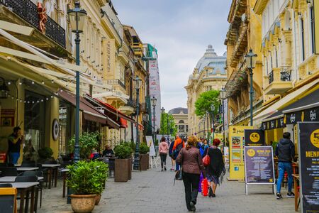 Bucharest, Romania, May 17, 2019: Tourists and locals walk along the old street of Bucharest, many cafes and souvenir shopsのeditorial素材