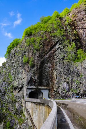 View of the road and the tunnel through the mountain, selective focusの写真素材