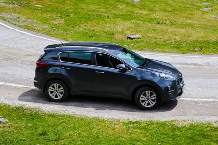 Slovakia, April 24, 2019: Kia Sportage stands on the side of a mountain roadのeditorial素材