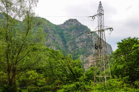 High power tower pole against blue sky in Romania. Electrical power lines and pylonsの写真素材