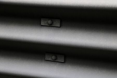 View of the iron gray-black construction, road fence, chipper, selective focus, backgroundの写真素材
