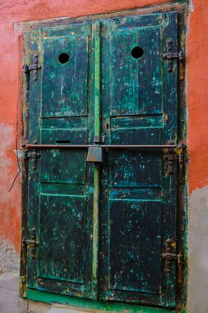 Sibiu, Romania, May 15, 2019: Traditional, colorful, decaying wooden courtyard doors of old townhouses in the centerのeditorial素材