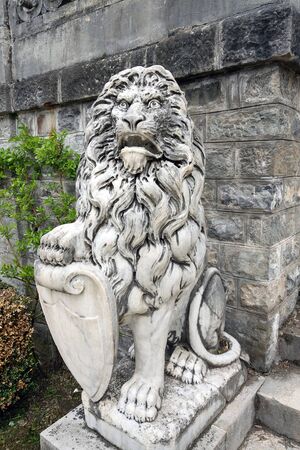 Lion statue on the slope. Old sculptureの写真素材