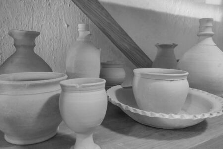Ceramic products on shelf of potter. Pottery for sale. Ceramic goods on shelfの写真素材