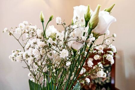 White roses flower arrangement in a glass vaseの写真素材