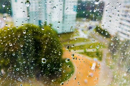 water drop, rain drop on glass and dripping downの写真素材