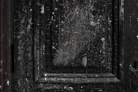Texture of an old wooden dark door, backgroundの写真素材