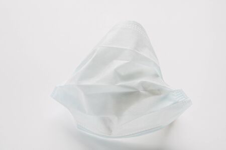Protective mask on a white background. Coronavirus COVID-19 is leading to mass mask shortages in the 2020の写真素材