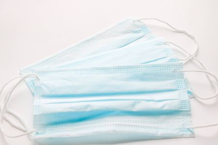 Protective surgical masks isolated in white backgroundの写真素材