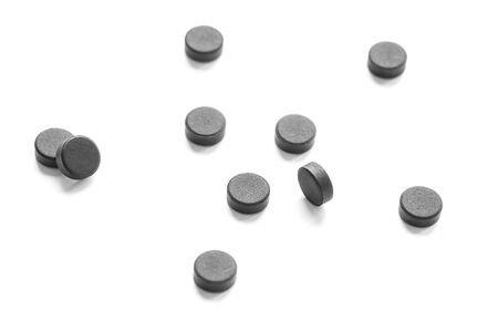 Absorbent carbon in pills on a white backgroundの写真素材