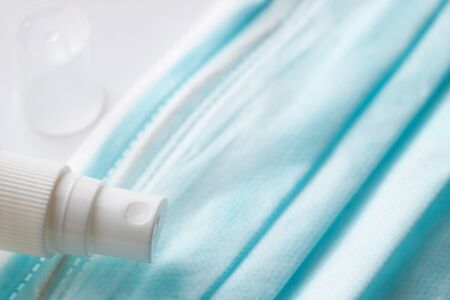 Disposable face masks and hand washing gel. Covid - 19, coronavirus