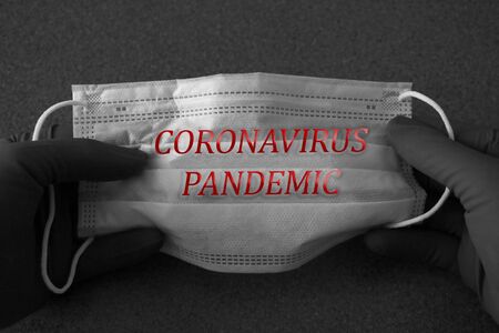 Dramatic atmosphere with surgical mask. Global pandemic alertの写真素材