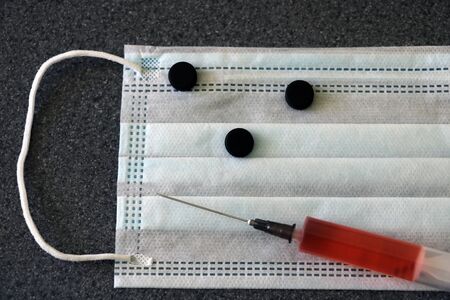 Vaccine for coronavirus 2019-nCoV. Photo of vaccine, medical injection and coronavirus. Stop coronavirusの写真素材