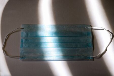 Dramatic atmosphere with surgical mask. Global pandemic alertの写真素材