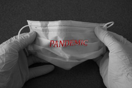 PANDEMIC text with protective masks. Coronavirus vaccine. Novel coronavirus 2019-nCoV, MERS-Cov middle East respiratory syndrome coronavirusの写真素材
