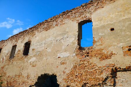 Ruined wall of an old red brick buildingの写真素材