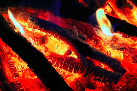 Burning Fire.Closeup. Bonfire, burning trees logs. Red, orange fire flame and smoke. Selective focusの写真素材