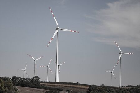 A windmill on a hillside. Green ecological power energy generationの写真素材