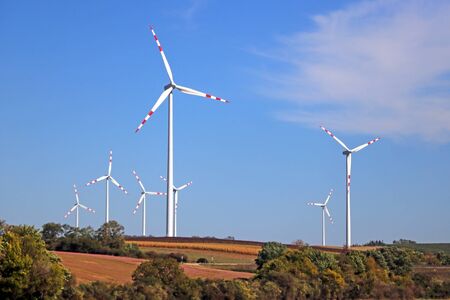 Wind turbines on beautiful sunny summer. Green ecological power energy generationの写真素材