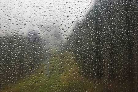 Raindrops on the glass of the cable car, selective focus