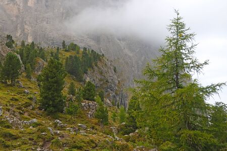 Foggy mountain landscape in Dolomites in Italyの写真素材