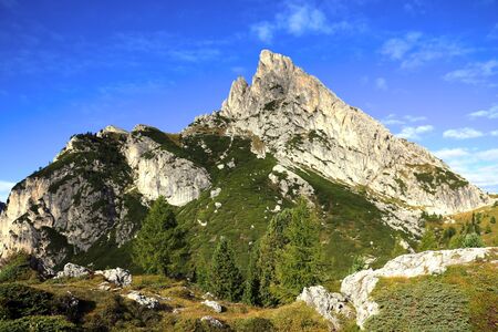 Beautiful Dolomites in Italy. Clear day with blue sky. Mountains are illuminated by the rays of the sun. Clean fresh air. Selective focusの写真素材