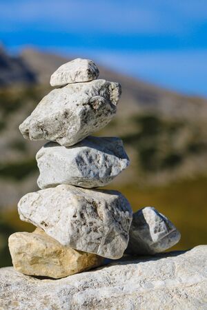 The wish stone tower on the rock and blur backgroundの写真素材
