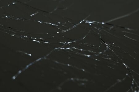 Broken mobile phone screen, background. Mobile phone repair. Selective focusの写真素材