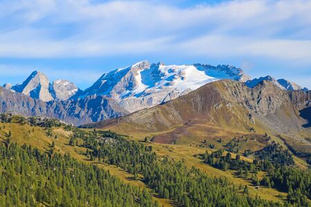 Beautiful Dolomites in Italy. Clear day with blue sky. Mountains are illuminated by the rays of the sun. Clean fresh air. Selective focusの写真素材