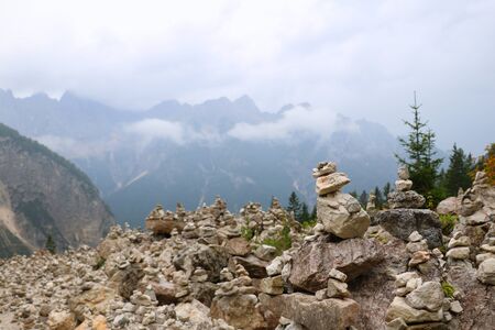 Stone tower made by tourists in mountainsの写真素材