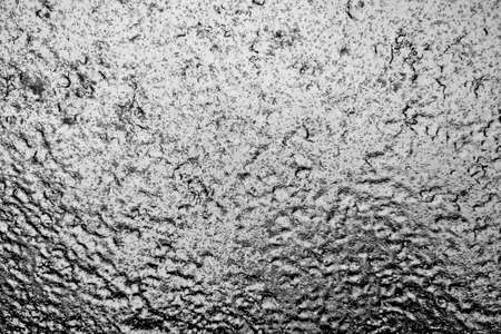 Close up view of a glass window covered with ice. Backgroundの写真素材