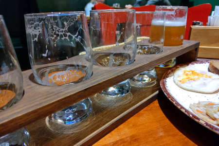 Empty glasses from various kind of beer in a barの写真素材