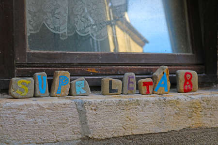 Colored stones by the window with the inscription Summerの写真素材