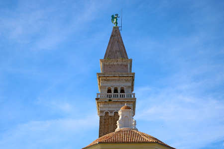 Piran, Slovenia, September 24, 2019: St. George's Parish Church on a blue sky backgroundのeditorial素材