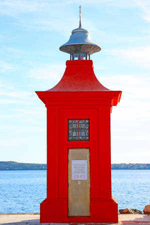 Red lighthouse on the pier in Piran, Sloveniaのeditorial素材