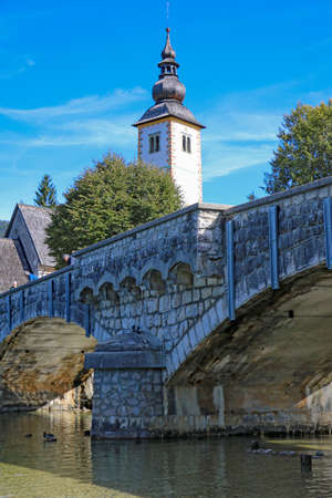 Church of St. John the Baptist and a bridge by the Bohinj lake, Sloveniaのeditorial素材