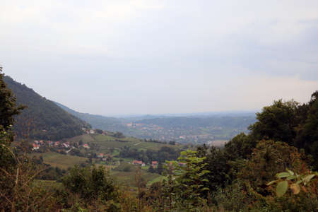 Mountain green meadows in a foggy morningの写真素材