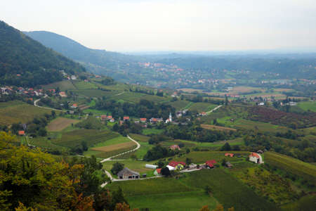 Mountain green meadows in a foggy morningの写真素材