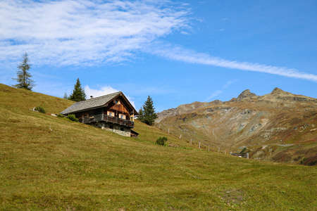 Beautiful small wooden house on a mountainsideの写真素材