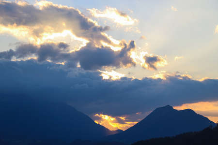 Beautiful mountain sunset against the backdrop of mountains and forest