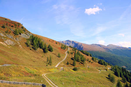 Great views to the peaks, valleys of the Austrian Alps. Charming and beautiful scene with meadowsの写真素材